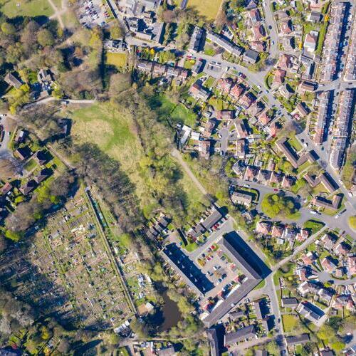 Straight down aerial photo of the British town of Meanwood in Leeds West Yorkshire showing typical UK housing estates and rows of houses in the spring